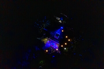 Aerial view of a vibrant nighttime outdoor event