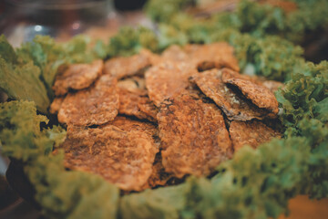 Crispy snacks on a bed of lettuce