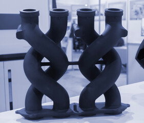 Object printed on 3D printer from molten plastic powder close-up. Model of black color printed on 3D printer from melted polyamide powder. Modern additive 3D printing technology. Multi Jet Fusion MJF