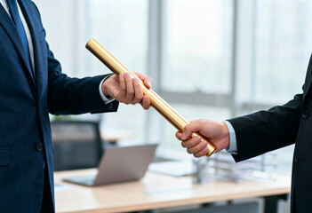 Business succession, leadership transition and teamwork concept with employees passing golden baton in modern office for collaboration, responsibility and management handover