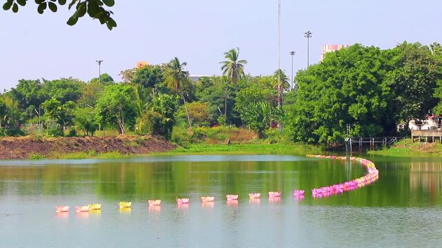 Lake with green tropical nature panorama view blue sky Thailand.