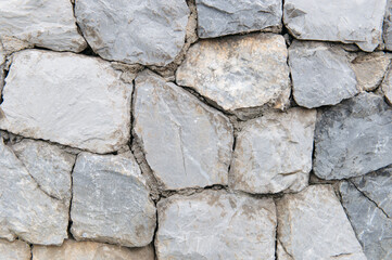 Close-up of rough stone wall texture