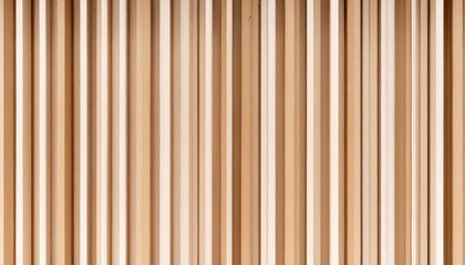 Obraz premium Vertical lines of light wood create a repeating pattern, emphasizing texture and depth. The varying shades suggest light play, enhancing the warm tones of the wood.