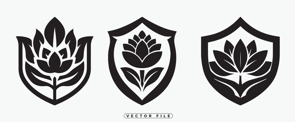 Fototapeta premium three shields featuring floral designs in black and white