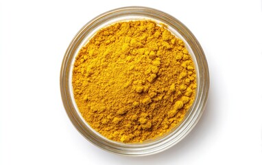 Yellow spice powder in small glass bowl