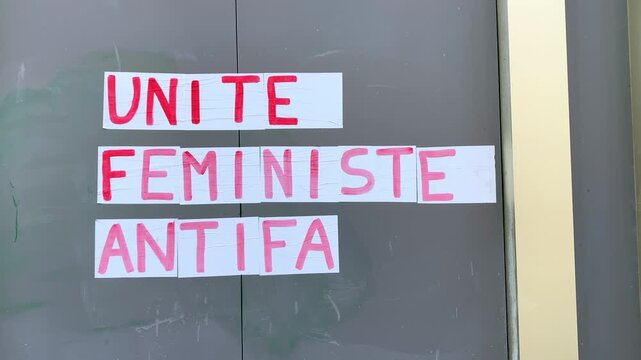 Antifa feminist unity protest poster pasted by members of a feminist movement