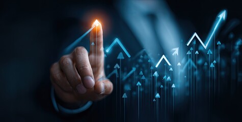 Businessman's finger points to upward trend