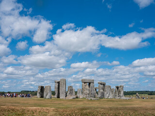 ancient ruins of stonehenge under blue sky