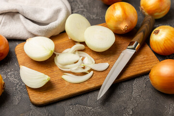 Onion on the kitchen table. onion slice. onion rings. Fresh Yellow Onion. Natural, fresh, vegetarian food. Agricultural products. Healthy eating. Vegetables. Farmer's market. Space for text.Copy space