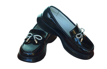 Shiny black girls' shoes stand on a white background