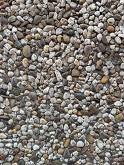 stone High-resolution background of small multicolored pebbles and stones forming a natural textured surface, ideal for abstract or decorative design use.