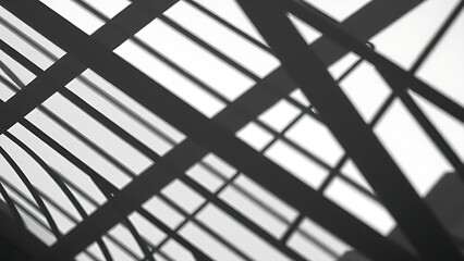 Geometric architectural composition with striking shadows and monochrome aesthetic.