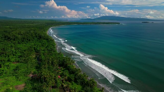 Cape Wom beach Dogreto Bay Madang Wewak Harbor View Papua New Guinea aerial drone Kavieng Vanimo Tufi coastline sunny blue sky clouds untouched remote Mushu Island tropical shore waves circle left