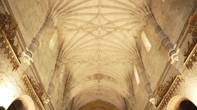 historic church interior with vaulted ceiling and gilded altar
