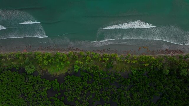 Wave swell Cape Wom Public Beach Dogreto Bay Madang Wewak harbor view Papua New Guinea aerial drone Kavieng Vanimo Tufi island coastline sunny pristine untouched remote tropical shore left motion
