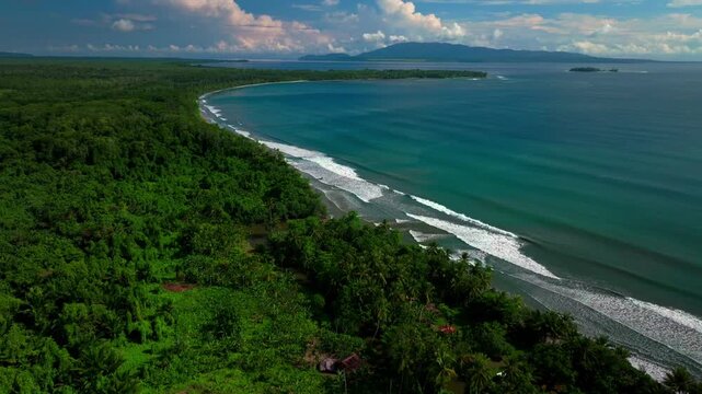 Cape Wom beach Dogreto Bay Madang Wewak Harbor View Papua New Guinea aerial drone Kavieng Vanimo Tufi coastline sunny blue sky untouched remote Mushu Island tropical shoreline waves forward pan up