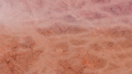 Detailed close up view of a pink and peach colored marble texture background suitable for modern design projects and applications