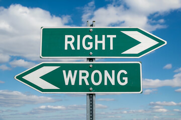 Two green directional road signs pointing opposite directions right and wrong directional sign