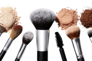 Overhead Close-up of an Assortment of Makeup Brushes and Powder