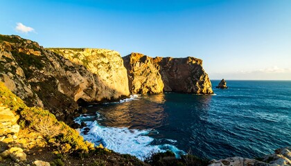 Dramatic coastal cliffs meet the ocean at sunset