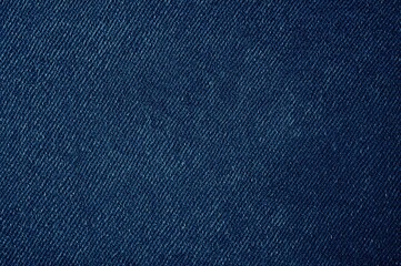 Close-up of dark blue denim fabric texture and weaving pattern
