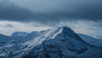A view of mountain peaks beneath an overcast sky