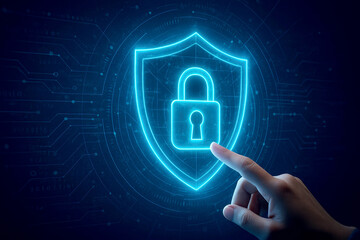 Finger pressing glowing blue shield icon with padlock on digital circuit board security protection