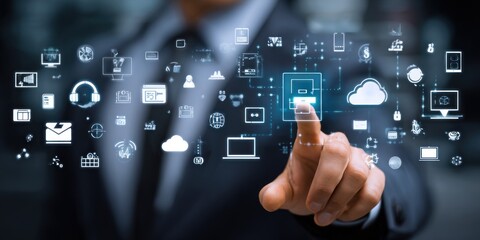 Business person interacts with glowing digital icons overlayed. Modern tech, dark suit, and a pointing finger