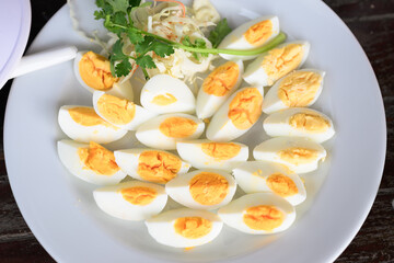 Hard boiled eggs slices served on plate