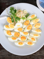 Hard boiled eggs slices served on plate