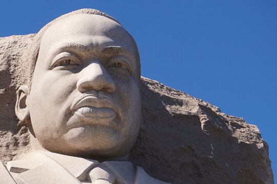 Close up portrait of the head of the statue of historic African American civil rights leader Martin Luther King Jr. at MLK Memorial in Washington, DC