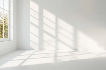 Fototapeta premium Minimalist White Studio Setting with Sunlit Window Shadows and Soft Focus Backdrop for Product Presentation