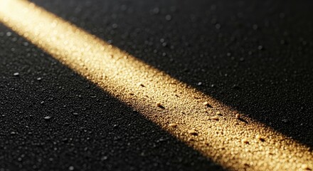 Fototapeta premium Sunlight Beam Across Dark Wet Sand, Sparkling Water Droplets, Texture Close Up