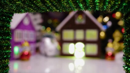 A half-blurred town in the middle of a green wreath