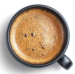 Overhead shot of a dark cup filled with frothy brown liquid, isolated against a plain white background