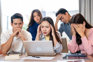 Fototapeta premium Tired business team are having a briefing meeting, can't find solution. Exhausted male and female employees fail a startup, upset about work troubles, unsuccess and overwork concept.