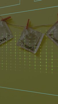 Animation of cardiograph over condoms on yellow background