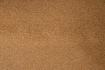 Brown felt fabric texture close up background for design