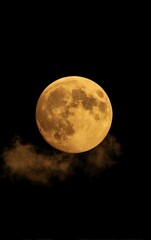 Full, amber moon, clouds