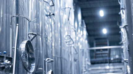 Modern stainless steel brewery equipment in industrial beer factory setting