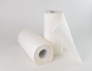 two rolls of paper towels on a white background