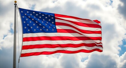Obraz premium American flag waving proudly against a backdrop of fluffy white clouds