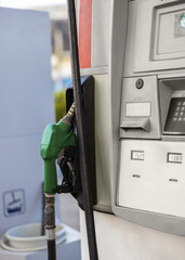 Portrait shot of Gasoline diesel Fuel dispenser. Filling Fuel pumps station, oil pump and nozzles at gas station on the street at daytime