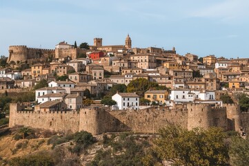 Fototapeta premium A charming town featuring ancient fortified walls from the Almohad era, situated along a famous pilgrimage path.
