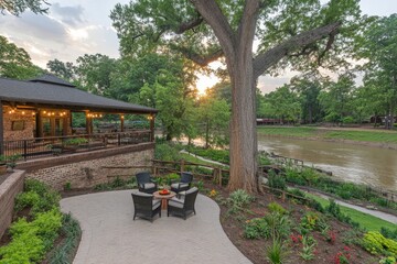 Scenic riverside patio with seating and sunset view near a lush landscape and cozy gathering spot