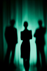 Silhouettes of Business Team in a Mystical, Green Light