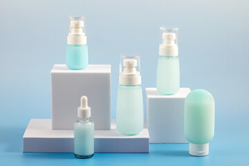 Bottles of natural cosmetics for skin care on white catwalks.  Product presentation. Product concept for beauty and body care.