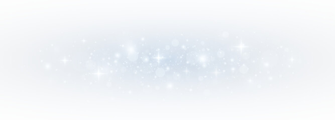 Glistering blue bokeh with sparkling stardust and festive confetti. Magical light and glittering particles forming a vibrant Christmas card effect.