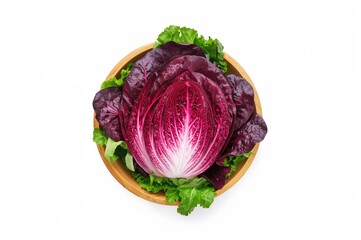 Obraz premium Crisp red radicchio tossed in a wooden bowl, displayed against a white backdrop with clear focus and overhead perspective.