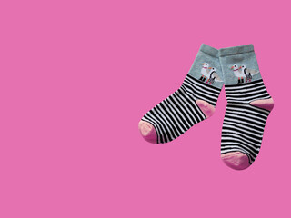 Bright children's multi-colored socks with decorative pattern, top view	